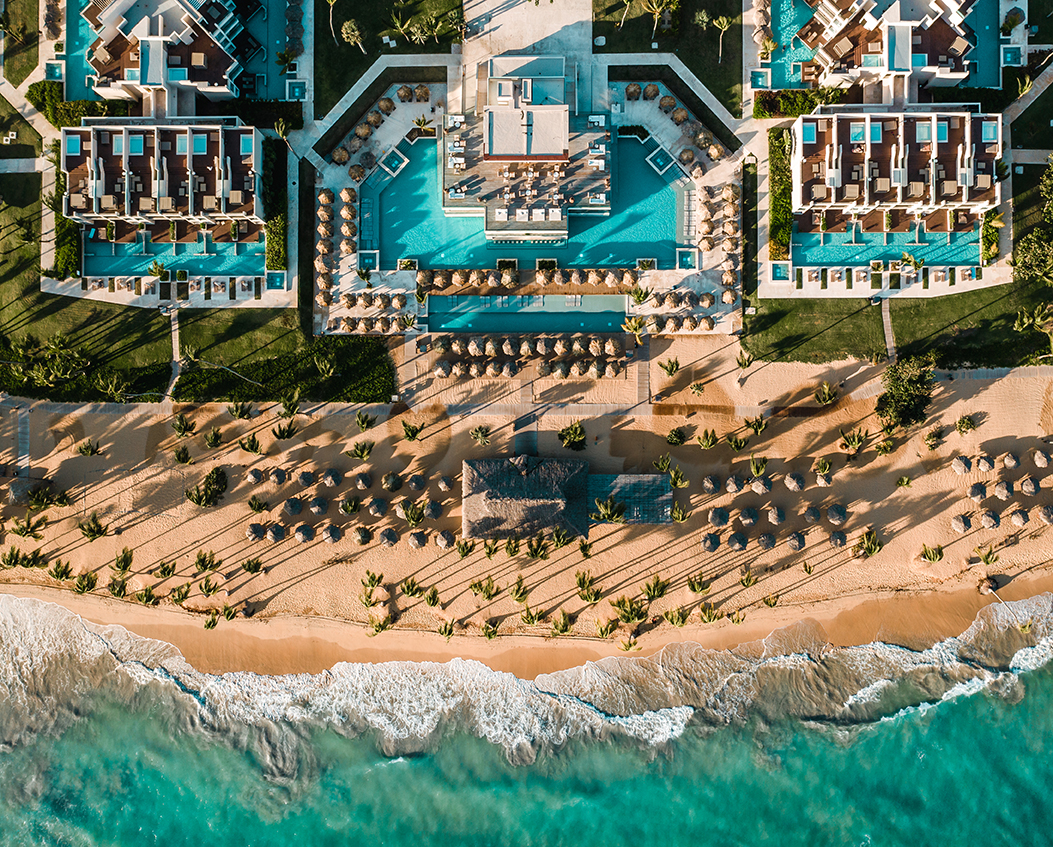 Excellence El Carmen adults-only all-inclusive resort with modern architecture, expansive pools, and beachfront luxury in Punta Cana.