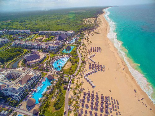 Hard Rock Hotel & Casino Punta Cana mega-resort with massive pools, casino, entertainment venues, and beachfront setting.