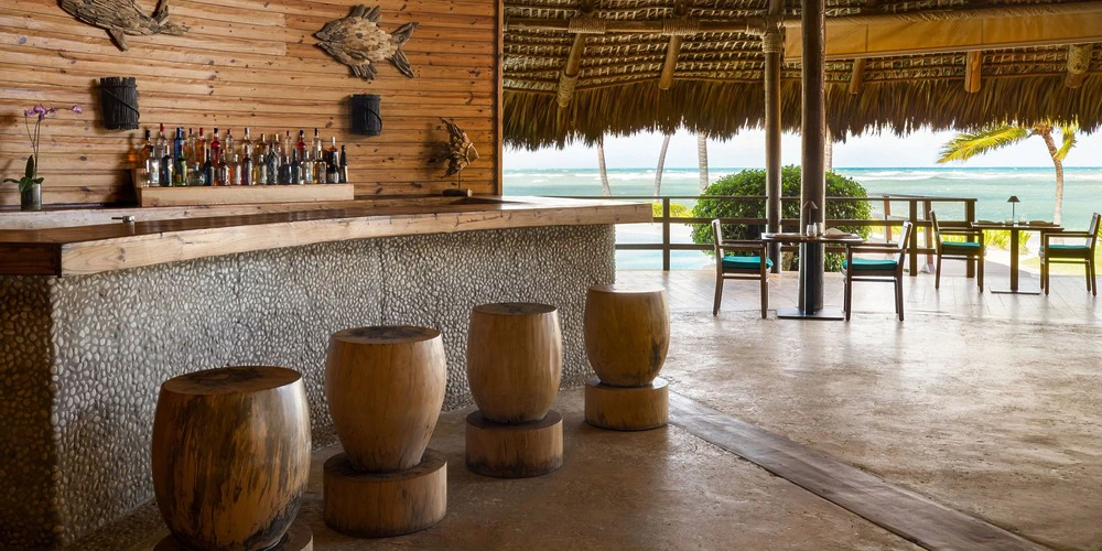Open-air Indigo Bar with ocean views at Zoetry Agua Punta Cana