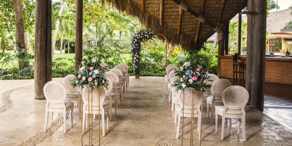 Open-air lobby wedding ceremony setup at Zoetry Agua Punta Cana with tropical garden views