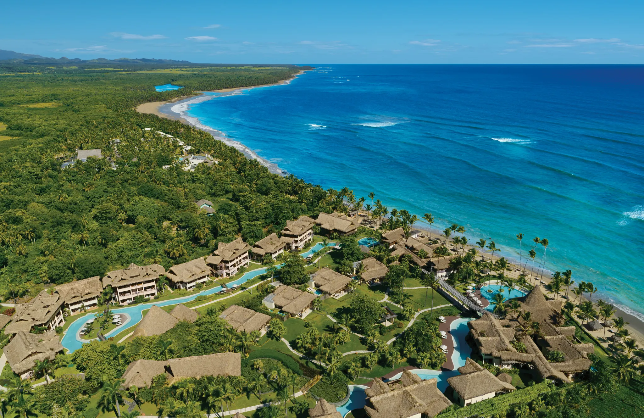 Aerial view of Zoëtry Agua Punta Cana along the turquoise Caribbean coastline.