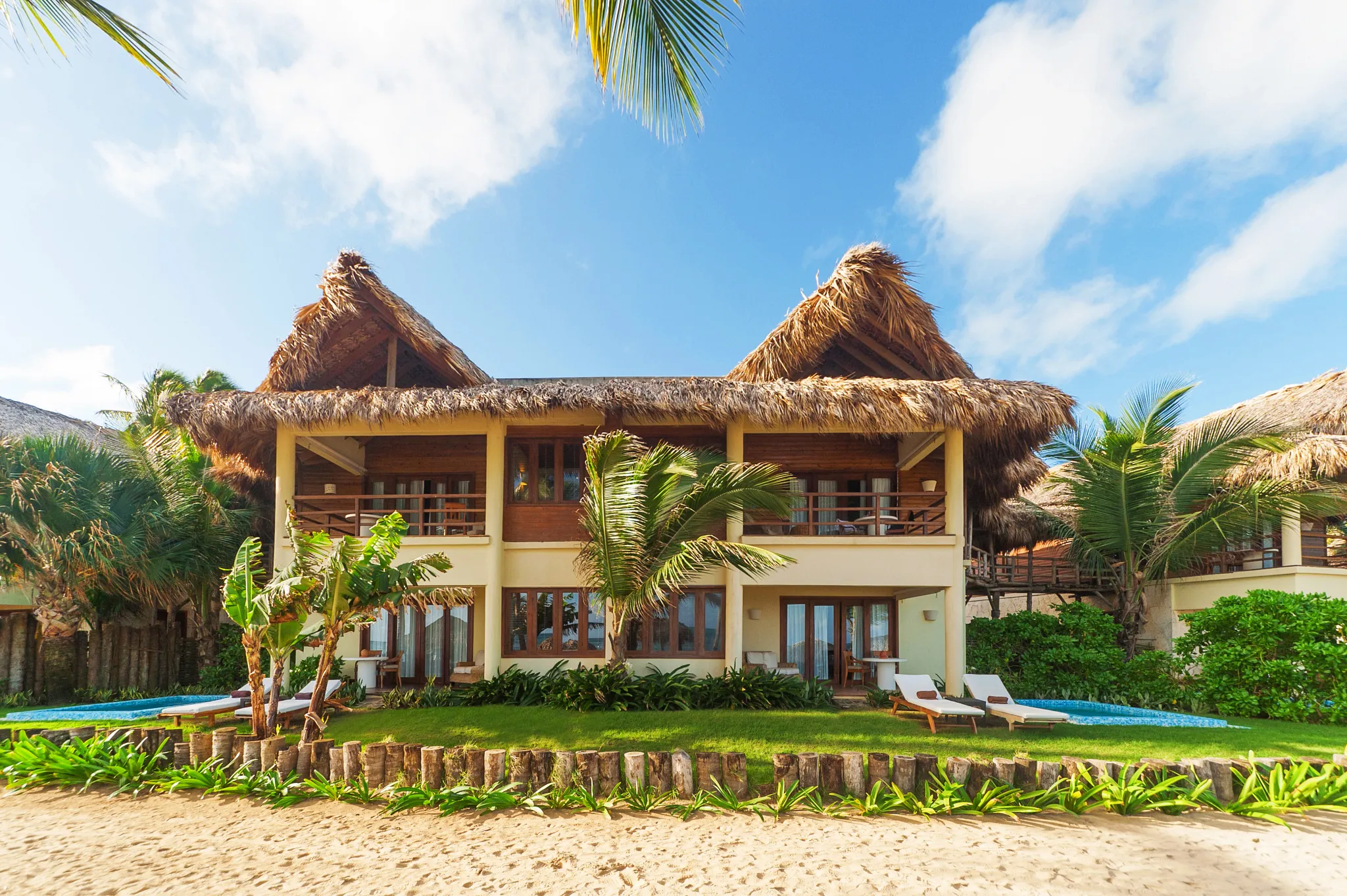Beachfront thatched-roof suites with private terraces at Zoëtry Agua Punta Cana in Punta Cana.