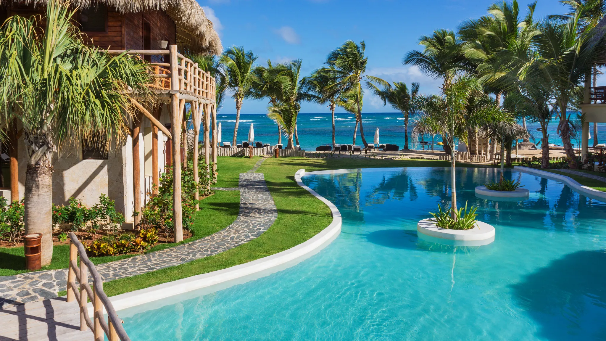 Lagoon-style pool overlooking the Caribbean Sea at Zoëtry Agua Punta Cana.
