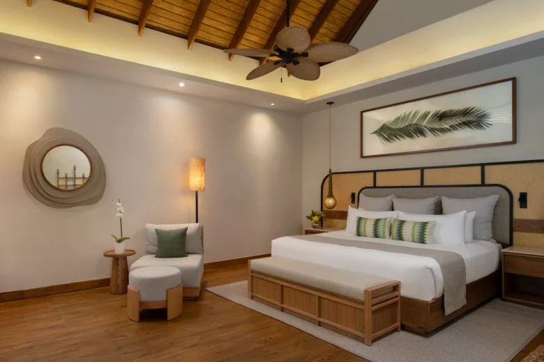 Villa Caribe Garden View king bedroom with vaulted wood ceiling at Zoëtry Agua Punta Cana.